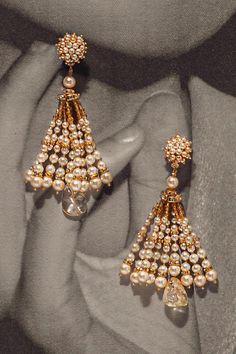 Gold toned earrings embellished with dangling pearl tassels and citrine drops.

Type: Pearls, Citrine
Color: Ivory, Gold
Other Details: 
Clustered top
Pearl tassels
Closure: Push back clasp
 - Aza Fashions Top Pearl, Tassel Earring, Dangler Earrings, Tarun Tahiliani, Gold Jewelry Earrings, Jewellery Earrings, Fashion App, Buy Gold, Online Earrings