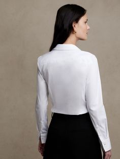 Our fitted shirt with darts at the back that nip in the waist for a tailored look.  Now in a shorter length that’s perfect tucked or untucked.  Made in our super-stretch cotton poplin for a flattering, comfortable fit.  Point collar.  Clean front. Modern Tailored Semi-formal Tops, Modern Tailored Top For Semi-formal Occasions, Sleek Tops For Workwear, Fitted Blouse With Shirttail Hem For Business Casual, Tailored Sleek Tops For Work, Tailored Top With Concealed Placket For Workwear, Sleek Tops With Concealed Placket For Work, Modern Tops For Workwear With Concealed Placket, Modern Tailored Tops With Spread Collar