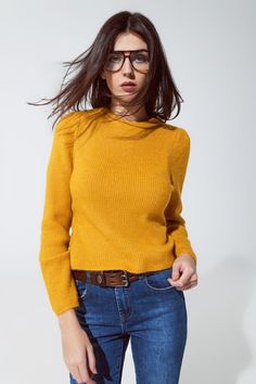 Embrace comfort and style with our Cozy Mustard Yellow Chunky Ribbed Jumper, a versatile addition to your wardrobe that's perfect for various occasions. Vibrant Mustard Yellow Color: Brighten up your day with the sweater's eye-catching mustard yellow hue, a color that complements a wide range of skin tones and adds a cheerful touch to any outfit. Comfortable Chunky Ribbed Knit: Crafted from a cozy blend of 74% Acrylic, 22% Polyester, and 4% Elastane, this jumper offers both warmth and comfort, m Cozy Sweater With Ribbed Neckline For Work, Cozy Stretch Tops For Work, Trendy Ribbed Sweater For Layering, Winter Workwear Sweater With Ribbed Neckline, Trendy Stretch Sweater With Ribbed Neckline, Fall Sweater With Stretch And Ribbed Neckline, Fall Sweater With Ribbed Neckline And Stretch, Stretch Sweater With Ribbed Neckline For Fall, Yellow Turtleneck Top For Winter