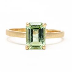 That's right, you will experience the cool pleasure of this gorgeous mint tourmaline. Fresh and effervescent, your heart will tingle with delight as you pair this with mutually exclusive colors and stacking rings. This beautiful 14k gold stacking stone ring features a green tourmaline. Pictured in:14k yellow gold1.15ct 8x6mm green tourmaline1.5mm wide Jennifer Dawes Design curates the most beautiful collection of diamond and precious gemstones available for all of our designs. Many of our stones Classic Green Emerald Cut Stackable Rings, Classic Green Emerald-cut Stackable Rings, Emerald Cut Green Stackable Rings In 14k Gold, Green Solitaire Stackable Rings In 14k Gold, Green Sapphire Stackable Ring Fine Jewelry, 14k Gold Green Solitaire Stackable Rings, Classic Green 14k Gold Stackable Rings, Green Gemstone Stackable Rings In 14k Gold, Green Solitaire Birthstone Ring In 14k Gold