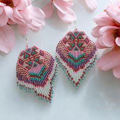 Elevate your jewelry collection with these stunning native made beaded earrings in a beautiful colorful colors. Handcrafted with intricate details, these unique extra long earrings are a true piece of art to wear jewelry. Perfect for adding a touch of bohemian charm to any outfit, these native made fringe earrings make a thoughtful and stylish sister in law gift. Handmade with care and attention to detail, these seed bead dangle earrings are sure to become a cherished addition to her jewelry collection. Details of such native-made beaded earrings: Materials: high quality Preciosa beads (size 10), special strong thread, 925 silver hooks. Size: width- 1.5 inch /4 cm; length (with ear wires) - 5.5 inches / 14 cm. These earrings are very lightweight statement earrings. They are comfortable for