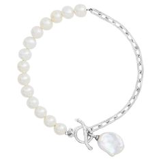 A playful modern take on a classic Dower & Hall design, this eclectic Luna Pearls bracelet combines 6mm round freshwater pearls and sterling silver rectangular link chain to dramatic effect. Accented with a 12 x 10mm keshi pearl drop, it fastens with a hammered t-bar and loop clasp. A timeless classic with a twist. We have been creating a wonderful world of everyday and fine jewellery since 1990 and have become known for our easy-to-wear pieces that become treasured favourites. Over the years ou