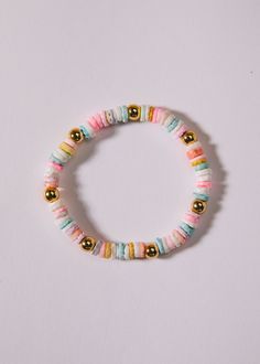 the beaded bracelet has gold beads and multicolored beads on it's side