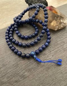 This Lapis Lazuli Mala necklace has a beautiful blue tone that will be easy to match your everyday outfits and keep you calm and grounded if you use it while meditating. Its a unique decor item also. A perfect gift for a yoga lover, or someone that loves stones. You can use it as a necklace or wrap it around the wrist and becomes a bracelet. The Mala necklace has a drop length of 43cm- 17 inch. A most have addition to your jewelry collection. ⚡️Join Akashi's VIP list for early bird discount acce Spiritual Beaded Bracelets, Spiritual Polished Beads For Meditation, Spiritual Round Beads Jewelry For Meditation, Spiritual Blue Lapis Lazuli Beaded Bracelets, Holistic Beaded Bracelets With Round Beads For Meditation, Blue Spiritual Beaded Bracelets, Spiritual Blue Beaded Bracelets, Spiritual Jewelry With 8mm Round Beads, Holistic Blue Beaded Bracelets For Meditation