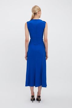 Elegant dresses are fundamental to the Victoria Beckham customer and the Sleeveless Gathered Waist Midi Dress offers a contemporary but timeless aesthetic. A gently curved V neckline, flattering pleat detail at the front of the skirt and longer-length hem at the back create a softly feminine silhouette. Contrasting topstitching looks fresh and modern, while reinforced folds at the front of the skirt add to the fluidity of the piece. Styled with the Classic Mule and Chain Pouch Bag Victoria Beckh Timeless Aesthetic, Feminine Silhouette, Dress Summer, Pouch Bag, Victoria Beckham, Long Length, Elegant Dresses, Mule, Palace