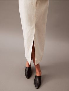 A modern midi skirt with a tailored look in a soft linen blend. Finished with tonal stitching for a clean look and a vented front for easy movement.  Material: 40% Cupro, 35% Linen, 25% Cotton. Clean Look, Linen Blend, Midi Skirt, Calvin Klein, Stitching, Skirt, Cross Stitching