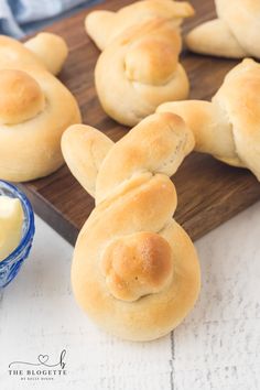 bread buns with butter on a cutting board