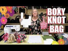 a woman standing in front of a sewing machine with the words boxy knott bag on it