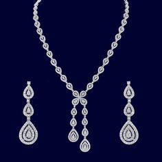 style #1135 For a beautifully classic look, this elegant lariat necklace is breathtaking. The necklace matches a delicate three drop diamond earrings. The diamonds are G color and VS quality, set in 18K white gold. Diamond weight: 7.32 CTW Drop Diamond Earrings, Usa Art, Diamond Drop Earrings, Lariat Necklace, Exquisite Jewelry, Classic Looks, Jewelry Art, Gold Diamond, Diamond Earrings