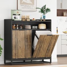 an open cabinet in the corner of a room with plants and other items on it