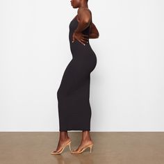 Everything you love about our signature Fits Everybody collection, now in an ultra-flattering dress. This double-lined silhouette is made to hug your body and offer a snatched, smoothed look. Fits true to size. | SKIMS Long Slip Dress | Black | 2XS | Fits Everybody Elegant Fitted Maxi Dress With Built-in Bra, Elegant Fitted Midi Dress With Built-in Bra, Fitted Maxi Dress With Built-in Bra For Date Night, Sleek Sleeveless Seamless Dress, Fitted Maxi Dress With Built-in Bra For Night Out, Sleeveless Solid Dress With Smoothing Details, Solid Sleeveless Dress With Smoothing Detail, Flattering Fitted Dress With Built-in Bra, Fitted Longline Midi Dress For Date Night