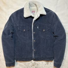 International Shipping Available!  This is a killer Vintage 1980s Levis Sherpa Lined Corduroy Jacket in navy blue! This is in worn in vintage condition as pictured. This is around a mens size S/M and labeled a mens 40. Please refer to all pictures and measurements before buying since all sales are final. All measurements taken while laying flat.  22.5 inches from armpit to armpit. 24 inches from lower collar seam in back of neck to bottom of jacket. 19 inch shoulders. 24 inch sleeves. Since all Navy Vintage Outerwear With Pockets, Vintage Streetwear Outerwear With Corduroy Collar, Vintage Outerwear With Corduroy Collar For Streetwear, Vintage Denim Jacket With Corduroy Collar For Winter, Vintage Navy Outerwear For Winter, Vintage Navy Cotton Outerwear, Vintage Cotton Denim Jacket For Winter, Jackets Aesthetic, Levis Sherpa