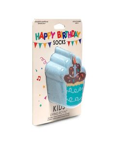 a blue birthday sock with a cupcake on it's side in front of a card