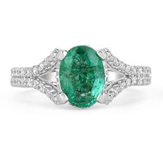 This is an exquisite, Colombian emerald and diamond halo split shank ring. The gorgeous setting lets sit an excellent quality Colombian emerald with beautiful color and very good eye clarity. The emerald is not perfect and small imperfections do exist as it is a natural gemstone. Near colorless diamonds halo around the emerald and down the split shank! This ring is incredibly comfortable to wear and would be an ideal engagement ring! Setting Style: Prong/Pave Setting Material: 14K White Gold Set Oval Emerald Ring In 14k White Gold, Oval Emerald Ring With Accent Stones In Platinum, Dazzling Oval Emerald Ring In Platinum, Oval Emerald Ring In White Gold With Diamond, Oval Emerald Ring With Prong Setting In Platinum, Oval Platinum Emerald Ring With Prong Setting, Oval White Gold Emerald Ring For Formal Occasions, Oval Emerald Ring With Halo Setting In Platinum, Elegant Oval Platinum Emerald Ring With Halo Setting