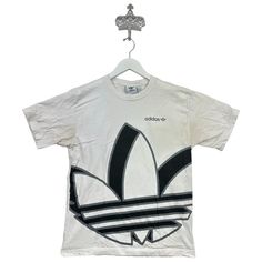 Recommended size: Medium  With discoloration/staining    Great Condition  ★ Era: 2000s MEASUREMENTS: Pit to Pit: 19 in Top to Bottom: 25 in Affordable Adidas Graphic Tee, Streetwear Bleached Graphic Tee T-shirt, White Y2k Shirt For Streetwear, White Y2k Style Shirt For Streetwear, 90s Style White Streetwear Shirt, White Bleached Tops For Streetwear, White Bleached Top For Streetwear, Adidas Graphic Tee For Streetwear, Birthday List