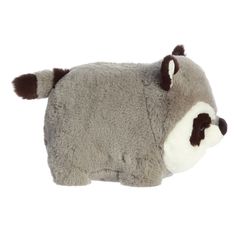 a raccoon stuffed animal is laying down