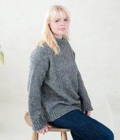 This cozy, soft knit sweater made from soft alpaca wool blend yarn. It has a slightly oversized fit, giving it a relaxed, comfortable look, with a high neckline resembling a loose turtleneck or cowl neck. The color of the jumper is a medium-to-dark gray, offering a neutral tone that pairs well with various outfits. The sleeves are long and slightly loose, adding to the overall laid-back, cozy aesthetic. The texture of the jumper is really  thick and warm, making it ideal for cooler weather. Care Jumper For Women, Loose Turtleneck, Collar Jumper, Lambswool Sweater, Cozy Aesthetic, Womens Sweaters, Stand Up Collar, Cooler Weather, Sweater Making