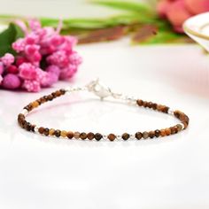 Tigers Eye Bracelet, Dainty Crystal Bracelets for Women, Gemstone Jewelry, Gifts for Her, christmas Gifts This bracelet is very dainty - beads measure about 2-2.5mm apiece AAA Quality Please Feel Free To Contact If You Have Any Query. Orders are shipped within 1 business working day, excluding orders made on Sunday or national holidays. Domestic delivery takes 5-7 business days. International delivery takes 11-23 business days. PAYMENT METHOD : PayPal only Please send all payments within 7 days Tigers Eye Bracelet, Yellow Gemstones, Tiger Eye Bracelet, Bracelet Dainty, Tigers Eye, Bracelet Stack, Gemstone Bracelet, Crystal Bracelets, Tiger Eye