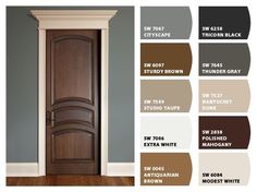 an open door in a room with wood flooring and paint colors on the walls