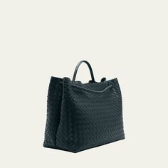 Bottega Veneta "Andiamo" tote bag in intrecciato napa leather  Rolled top handle  Open top with magnetic closure; center adjustable knot strap  Interior, one zip pocket and one slip pocket  Approx. 13.8"H x 16.5"W x 7.1"D Made in Italy Leather Bag With Intrecciato Weave And Top Handle, Modern Bag With Intrecciato Weave And Double Handle, Modern Bags With Intrecciato Weave For Errands, Luxury Satchel With Braided Handles For Travel, Modern Satchel With Braided Handles For Errands, Modern Intrecciato Weave Bag For Errands, Luxury Woven Leather Bag With Double Handle, Luxury Satchel With Braided Double Handles, Modern Satchel With Intrecciato Weave For Daily Use