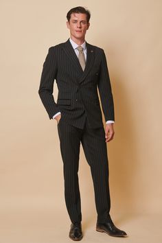 Meet our all new double breasted style, in classic black pinstripe. This exquisite double-breasted two-piece suit combines the timelessness of pinstripes with the sophistication of a tailored fit. The ultimate in luxurious fashion, Rocco is the perfect choice for an elegant look. Model wears size 40R blazer & 34R trousers. Features Slim fit Peak lapel Single back vent Four button cuff Double-breasted blazer fastening Complimentary pocket square Functional inside and outside pockets to the blazer Striped Double Breasted Suit For Semi-formal Occasions, Striped Tuxedo Suit For Business, Semi-formal Pinstripe Suit With Double Button Closure, Pinstripe Suit With Double Button For Semi-formal, Pinstripe Suit With Double Button For Semi-formal Occasions, Pinstripe Suits With Double Button Closure For Semi-formal Events, Pinstripe Suits With Double Button Closure For Semi-formal Occasions, Formal Pinstripe Double Breasted Suit With Notch Lapel, Tailored Striped Suits With Double Button Closure