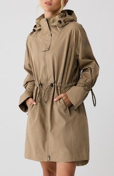 Travel confidently and comfortly in wet weather with this waterproof rain jacket designed for easy packing and breathability. 35" front length; 38" back length (size Medium) Drawcord-toggle hood Drawcord-toggle waist Waterproof Lined 100% polyester Machine wash, tumble dry Imported Women’s Raincoat, Khaki Waterproof Utility Parka, Khaki Utility Waterproof Parka, Fall Travel Raincoat With Storm Flap, Solid Color Parka With Adjustable Hood For Rainy Weather, Utility Waterproof Outerwear For Rainy Weather, Utility Style Waterproof Outerwear For Rainy Weather, Utility Weatherproof Raincoat For Fall, Utility Raincoat For Hiking In Fall