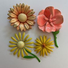 Lot of three in preowned vintage condition with some small chips/cracks to paint.  Largest measures approximately 3" tall Luxury Enamel Flower Brooches, Vintage Pink Collectible Brooches, Retro Flower Brooches For Collectors, Vintage Yellow Flower Brooch, Vintage Enamel Flower Brooch, Daisy Vintage, 70s Mod, Daisy Jewelry, Mid Century Jewelry