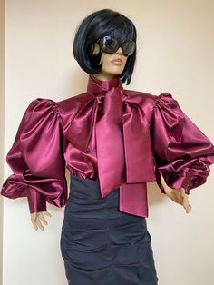 "Straight cut satin blouse with victorian collar, separate bow tie and extremely volume puffy sleeves. Closure with zipper at back. Product information Details Woven satin fabric Long puff sleeve with cuff High neck Zipper fastening Bow tie Fabric & care 3% Elastane, 97% Polyester Iron on reverse Machine wash at max 40oC gentle Do not bleach Dry flat Do not dry clean SIZE CHART SIZE S - US 6, UK 8, EU 36 bust: bust around 34.5\"/90cm Waist: waist around 27.5\"/70cm Hips: hips around 34.5\"/9 Bordeaux Dress, Black Satin Blouse, Fashion Week Dresses, Bishop Sleeve Blouse, Applique Blouse, Victorian Collar, Satin Bluse, Bordeaux Wine, Shoes Outfit Fashion