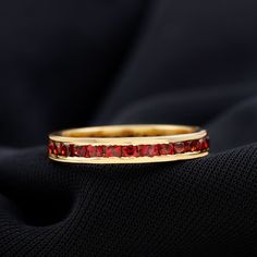 Product Details Make her feel happy with this fabulous Channel Set Eternity Band as a gift. This Stunning Full Eternity Ring is decorated with a Round Shape Garnet set in a channel setting. This Channel Set Garnet Eternity Band will be a beautiful Birthday gift for your love mounted in gold metal. Product Information SKU SHP-RINGS072018864 Width 1.6 mm Height 3 mm Weight 2.30 gm (Approximate) GARNET INFORMATION No.of Stones 31 Pieces Total Weight 1.61 Carat (Approximate) Dimension(approx) Round- Interesting Jewelry, Channel Setting, Beautiful Birthday, Full Eternity Ring, Eternity Band Ring, Feel Happy, Signature Jewelry, For Your Love, Timeless Jewelry