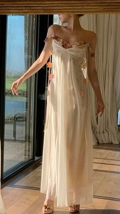 Ethereal Sleeveless Party Dress, Ethereal Sheer Dresses For Spring, Sheer Ethereal Spring Dresses, Spring Off-shoulder Sheer Dress, Feminine Summer Evening Maxi Dress, Feminine Evening Maxi Dress For Summer, Feminine Summer Maxi Dress For Evening, Spring Chiffon Backless Dress, Beige Dress With Delicate Straps For Spring