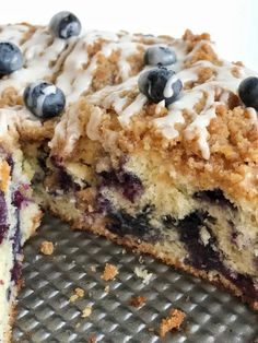 a close up of a cake with blueberries on it