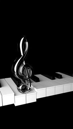 a black and white piano with a musical note on it