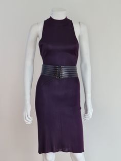 "Azzedine Alaïa Spring/Summer 1986 purple jersey dress and corset leather belt set. It's quite special to find a set with dress and belt together! Sleeveless dress in purple stretch acetate jersey with a subtle sheen, closure with eight press studs at the back from the neck to the waist. Black leather high-waist corset belt with several strips lacing, stud details and brass hardware. Dress Size S, measures (taken flat and unstretched): Armpit to armpit: 32 cm Waist: 29 cm Hips: 37 cm Length: 105 Purple Sleeveless Corset Dress, Fitted Party Dress With Belt, Elegant Fitted Corset Belt For Club, Fitted Evening Dresses With Belt, Fitted Belted Dress For Night Out, Fitted Corset Belt For Evening, Fitted Belted Purple Dress, Chic Fitted Corset Belt For Club, Fitted Corset Belt For Night Out