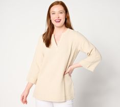 Simple-yet-stylish, this gauzy cotton top will be a mainstay in your summer wardrobe. Bell-shaped sleeves add dimension and create light and airy movement, while frayed edges give this tunic an undone, cool-and-carefree appeal. From Belle Beach by Kim Gravel. Spring Cotton V-neck Tunic, Cotton Split Neck Top For Summer, Spring Beige Cotton Tunic, Beige Cotton Tunic For Spring, Summer Tunic With Relaxed Fit And Split Neck, Cotton Beach Tops With 3/4 Sleeves, Linen Split Neck Top For Summer, Cotton Tops For Beach With 3/4 Sleeves, Summer Cotton Tunic For Spring