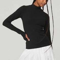 Wellness Rib Mock Neck Long Sleeve - Black | Alo Yoga Alo Yoga Long Sleeve Sporty Tops, Alo Yoga Long Sleeve Tops With Ribbed Cuffs, Versatile Black Second-skin Tops, High Stretch Ribbed Mock Neck Top, Long Sleeve Alo Yoga Tops For Fall, Alo Yoga Long Sleeve Tops For Fall, Alo Yoga Tops For Fall Layering, High Stretch Ribbed Funnel Neck Top, Fall Layering Tops By Alo Yoga