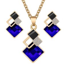 Expertly handcrafted, this stylish crystal pendant and earring set features a matching pendant and pierced earrings. This fine jewelry set comes in red, white, yellow, blue, green, gray, peacock blue, light blue, and pink all with gold trim and gold link chain. This is a perfect gift for a bridal party, engagement, wedding, birthday, graduation, Mother's Day, or the holiday season. Unique Bridal Jewelry, Geometric Pendant Necklace, Crystal Wedding Jewelry, Earrings Sets, Bridal Wedding Earrings, Crown Necklace, Crystal Pendants, Pendants Necklace, Heart Shaped Necklace