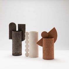 three different shapes and sizes of vases