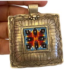 Aprox. 2"X 2" This Navajo Vintage Beaded Square Pendant Bracelet Is A True Piece Of American History. Handcrafted With 925 Sterling Silver, It Features Intricate Beadwork And A Charming Square Shape. The Pendant Is Adorned With A Bead Charm And Hangs From A Sturdy Chain. The Bracelet Is Perfect For Anyone Who Appreciates Native American Jewelry And Wants To Add A Unique Piece To Their Collection. It Is A Great Way To Show Off Your Tribal Affiliation And Will Surely Make A Statement. Don't Miss Out On This Exquisite Piece Of Art. Beaded Square, Southwestern Colors, Square Pendant, American Jewelry, Pendant Bracelet, Native American Jewelry, Square Shape, American Vintage, American History