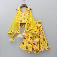 Stylish Patola Printed Yellow Cape Top And Asymmetric Palazzo Festive Cotton Sets With Back Tassel Tie-up, Cotton Party Sets With Ruffles, Cotton Lehenga For Summer Parties, Summer Cotton Lehenga For Party, Summer Party Cotton Lehenga, Fitted Tassel Sets For Spring, Fitted Sets With Tassels For Spring, Fitted Spring Sets With Tassels, Spring Festive Sets With Tassels