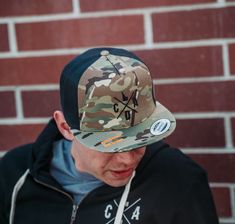 Check out this flat bill camo hat! Featuring our locally embroidered logo on the front. Camouflage Snapback Baseball Cap For Streetwear, Military Snapback Hat With Flat Bill For Outdoor, Military Style Snapback Hat With Flat Brim, Camouflage Flat Bill Baseball Cap For Streetwear, Casual Snapback Hat With Flat Crown For Outdoor, Camouflage Snapback Hat For Streetwear, Outdoor Camouflage Snapback Hat With Flat Brim, Casual Camouflage Trucker Hat With Flat Brim, Camouflage Snapback Hat For Outdoor