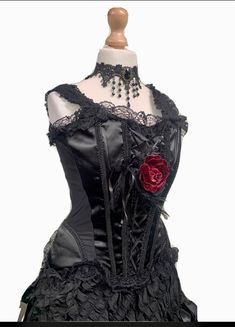 This is a high quality Raven gothic outfit consisting of the following;- 1. Hand crafted pretty choker 2.Black Satin corset with peplum and zip in the back .Size L fits Uk 14/16 chest 38/40 inch 3. pretty Red rose brooch with lace trim, beads and feathers. 4. Black heavy long skirt with elasticated waist band. It has ribbon detail.The fabric is unusual, fully lined . Please note the main photo has been taken with a hoop to show fullness. Thank you for looking Steampunk Black Corset For Halloween, Black Steampunk Corset For Halloween, Black Punk Overbust Corset, Punk Black Corset For Cosplay, Black Steampunk Corset For Costume Party, Steampunk Black Party Corset, Black Punk Corset For Costume Party, Black Punk Corset For Alternative Fashion, Black Steampunk Corset For Party