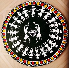 a black plate with white designs on it