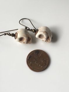 "10mm White Howlite magnesite stone skull dangle earrings, brass metals measure about 1.25\" Hand made Jewelry!" Howlite Stone, Gothic Earrings, White Howlite, Skull Earrings, Halloween Earrings, Girls Jewelry, Brass Metal, Hand Made Jewelry, Etsy Earrings