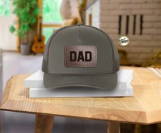 Personalized Dad Hat, Father's Day Custom Hat, Leather Patch Cap, New Dad Gift, Gift for Grandpa, Custom Patch Hat, Trucker Hat, Dady Hat We are here to offer you the best hat options which are perfect as a gift for you or your friend! These hats are the perfect addition to your everyday wardrobe. They can be paired with your workout fit for a morning walk or cozy sweatshirts while running errands. PRODUCT  **   65/35 polyester/cotton  **   Multicam is 60/39/1 cotton/polyester/PU spandex  **   S Brown Flat Bill Baseball Cap For Gift, Gift Brown Flat Bill Hat, Brown Flat Bill Hat As Gift, Brown Flat Bill Trucker Hat For Gift, Brown Flat Bill Trucker Hat As Gift, Brown Cap Hat For Gift, Brown Curved Brim Snapback Hat Gift, Brown Cap Hats As Gift, Brown Cap As Gift