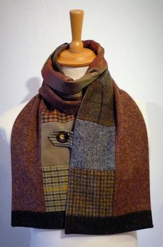 a mannequin wearing a brown and black scarf