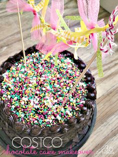 a chocolate cake topped with sprinkles and candy