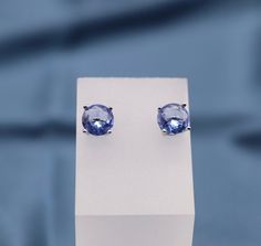 These stunning light blue gemstone stud earrings are reminiscent of the tranquil ocean waters, captivating with their serene and refreshing hue. Delicately crafted, they radiate a graceful and sophisticated charm, making them a beautiful choice for any occasion. Light Blue Gemstone Earrings - Fine Jewelry, Blue Tanzanite Round Earrings, Sapphire Tanzanite Jewelry With Matching Earrings, Tanzanite Birthstone Earrings For Gifts, Tanzanite Birthstone Earrings As Gift, Light Blue Gemstone Earrings For Anniversary, Sapphire Tanzanite Earrings For Gifts, Sapphire Tanzanite Earrings As Gift, Tanzanite Earrings As A Gift