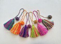 multicolored tasselled necklaces with pom poms