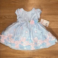 Light Blue Flower Dress. Size 12. Cuter Easter Dress! Brand New Blue Floral Applique Dress For Dress-up, Light Blue Floral Applique Summer Dress, Cute Blue Dresses With Floral Applique, Cute Blue Dress With Floral Applique, Light Blue Dress For Spring Dress-up Occasion, Spring Floral Pink Dress For Casual, Blue Dress For Dress-up In Spring, Spring Pink Floral Dress, Blue Floral Applique Dress For Summer