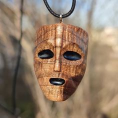 * This wooden face mask pendant is made entirely of natural walnut wood. * Handmade wooden mask necklace will be a wonderful and unique gift for yourself and your boyfriend. *  Wooden mask charms It will be a great gift for wood lovers. * 2mm special necklace rope is used on the necklace. You can be sure that it is very light and will not disturb you when it touches your skin. * At the end of the necklace rope, there is a small hook with a button to easily take off and put on your necklace. Than Streetwear Necklace, Sculpture Dremel, Punk Mask, Art Sculpture En Bois, Wood Jewelry Diy, Barber Tattoo, Hand Carved Jewelry, Wood Carving Faces, Dremel Carving